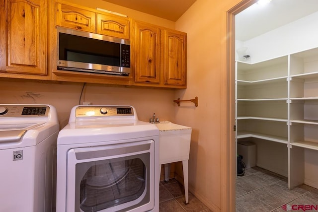 30 Stagecoach Rd, Bayfield, CO 81122 - laundry area featuring independent washer and dryer, cabinet space, tile patterned floors, and baseboards