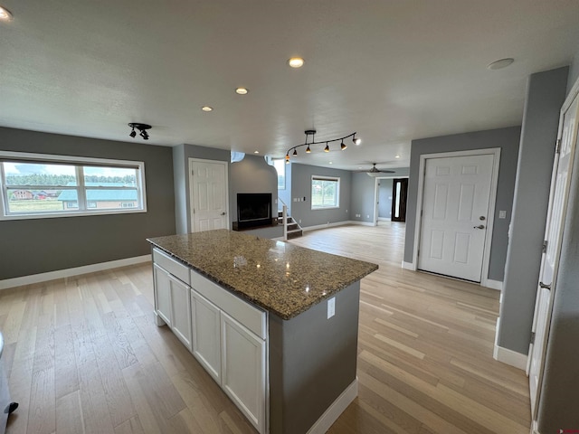 445 Saddle Cir, Pagosa Springs, CO 81147 - kitchen featuring a center island, light wood finished floors, baseboards, and recessed lighting