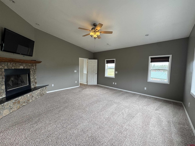445 Saddle Cir, Pagosa Springs, CO 81147 - unfurnished living room with a ceiling fan, carpet flooring, a fireplace, lofted ceiling, and baseboards