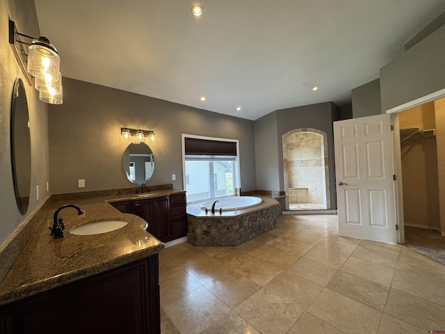 445 Saddle Cir, Pagosa Springs, CO 81147 - full bath featuring two vanities, a bath, tile patterned floors, and recessed lighting