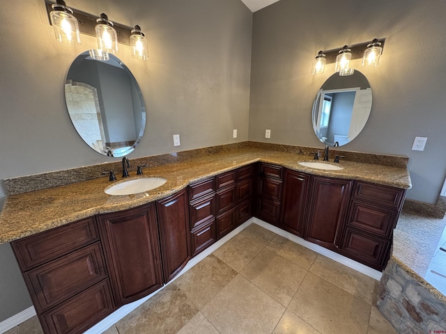 445 Saddle Cir, Pagosa Springs, CO 81147 - bathroom featuring double vanity and tile patterned floors