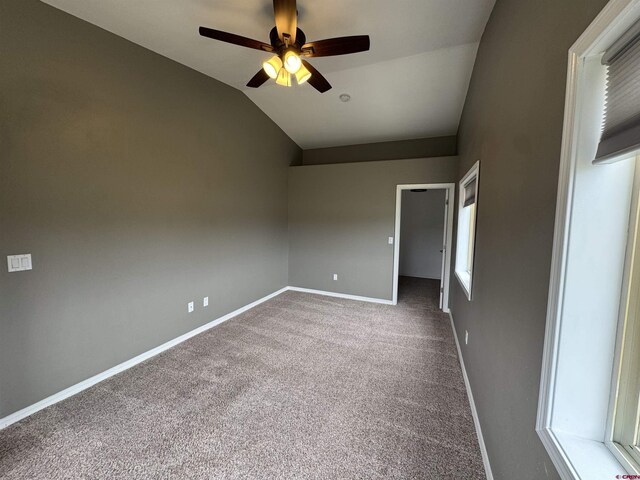 445 Saddle Cir, Pagosa Springs, CO 81147 - carpeted spare room featuring lofted ceiling, ceiling fan, and baseboards