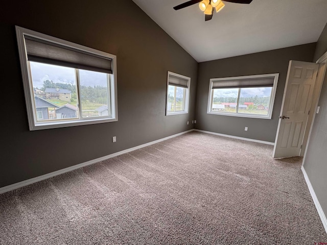 445 Saddle Cir, Pagosa Springs, CO 81147 - carpeted spare room featuring ceiling fan, vaulted ceiling, and baseboards