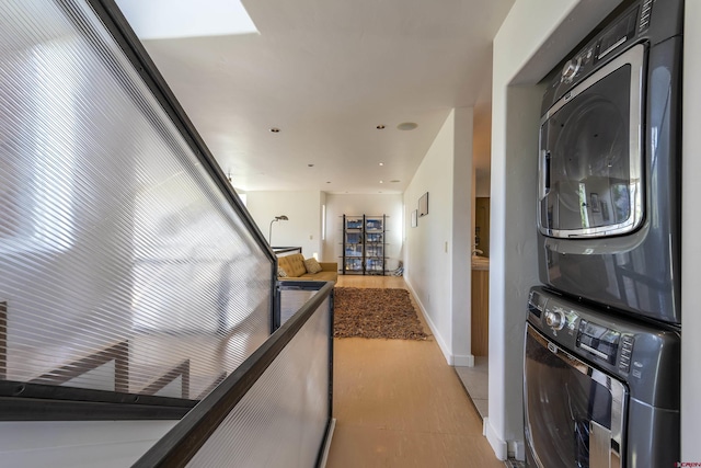 123 Boulders Way, Mountain Village, CO 81435 - washroom featuring estacked washer and dryer, baseboards, and recessed lighting