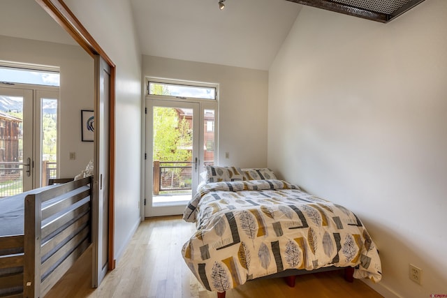 123 Boulders Way, Mountain Village, CO 81435 - bedroom featuring access to outside, lofted ceiling, and light wood-style flooring