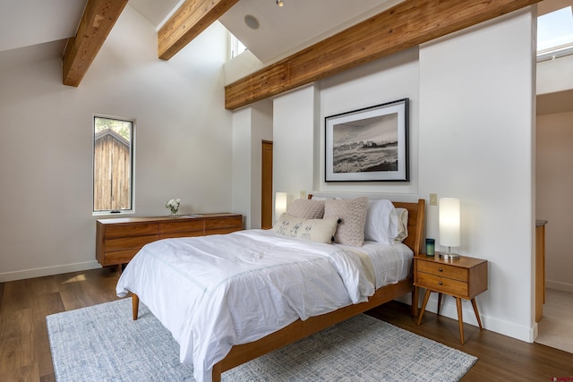 123 Boulders Way, Mountain Village, CO 81435 - bedroom with beamed ceiling, baseboards, wood finished floors, and high vaulted ceiling