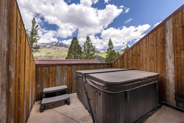 123 Boulders Way, Mountain Village, CO 81435 - view of yard with a hot tub, a mountain view, and a patio area
