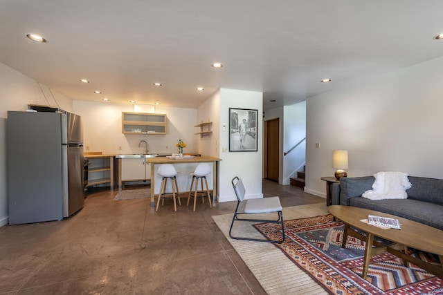 123 Boulders Way, Mountain Village, CO 81435 - living area with stairway, recessed lighting, baseboards, and bar with sink