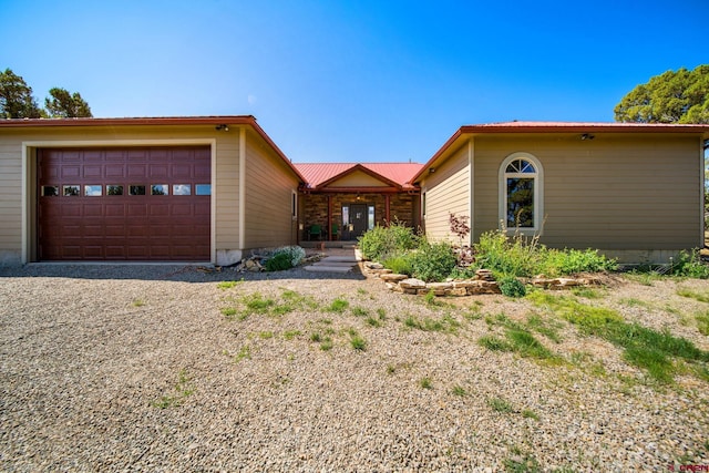 24180 Rd V.4, Dolores, CO 81323 - view of front of home featuring a garage and metal roof