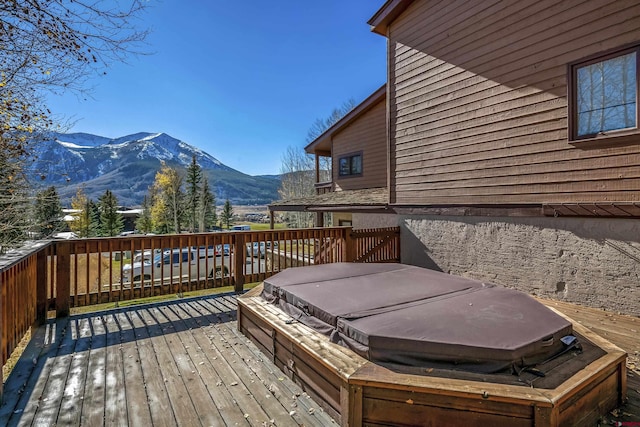 350 Country Club Dr Unit 308A, Crested Butte, CO 81224 - wooden deck with a covered hot tub and a mountain view