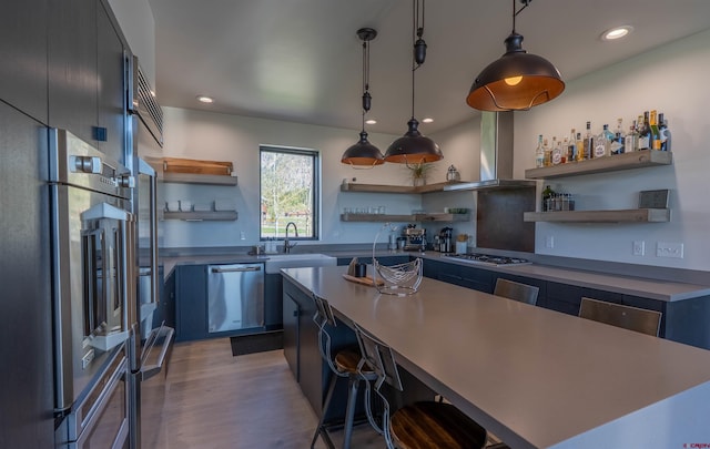 470 White Stallion Cir, Crested Butte, CO 81224 - kitchen featuring open shelves, stainless steel appliances, island exhaust hood, a kitchen island, and a breakfast bar area