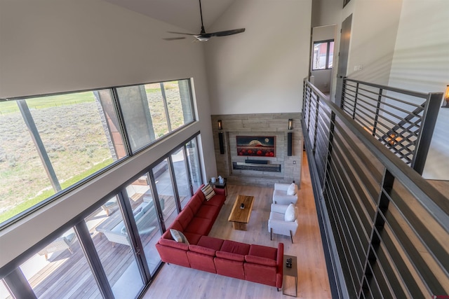 470 White Stallion Cir, Crested Butte, CO 81224 - living room featuring wood finished floors, a high ceiling, and a ceiling fan
