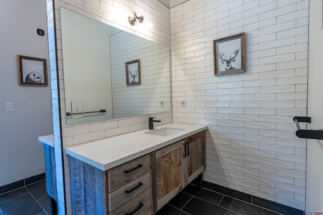 470 White Stallion Cir, Crested Butte, CO 81224 - bathroom featuring vanity, tile patterned floors, and tile walls