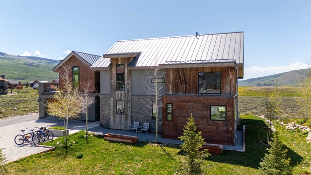 470 White Stallion Cir, Crested Butte, CO 81224 - modern home featuring a standing seam roof, a mountain view, and metal roof