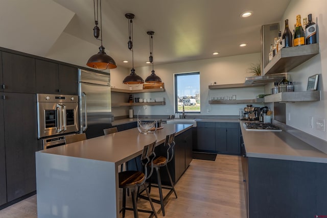 470 White Stallion Cir, Crested Butte, CO 81224 - kitchen featuring open shelves, stainless steel appliances, a kitchen bar, a center island, and recessed lighting