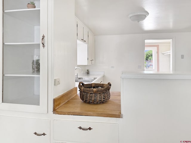 135 N 4th St, Hotchkiss, CO 81419 - kitchen featuring a sink, white cabinets, and light countertops