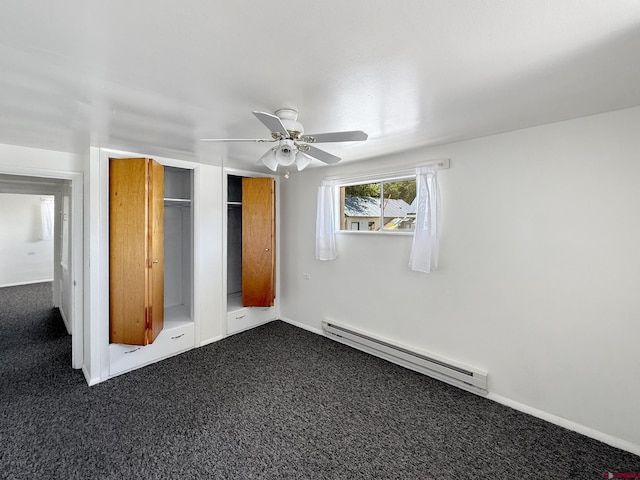 135 N 4th St, Hotchkiss, CO 81419 - unfurnished bedroom featuring baseboard heating, dark colored carpet, and ceiling fan