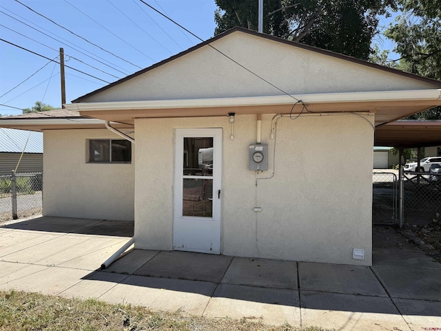 135 N 4th St, Hotchkiss, CO 81419 - property entrance featuring stucco siding and a patio