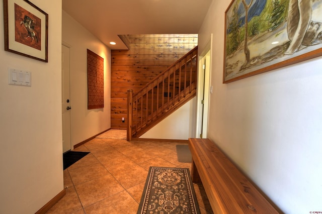 76 Pinnacle Dr, Ridgway, CO 81432 - tiled foyer entrance featuring stairway, recessed lighting, wood walls, and baseboards