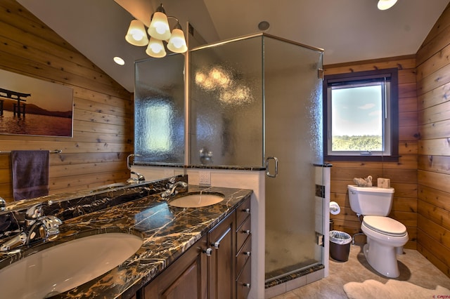 76 Pinnacle Dr, Ridgway, CO 81432 - bathroom featuring wooden walls, double vanity, toilet, a stall shower, and lofted ceiling