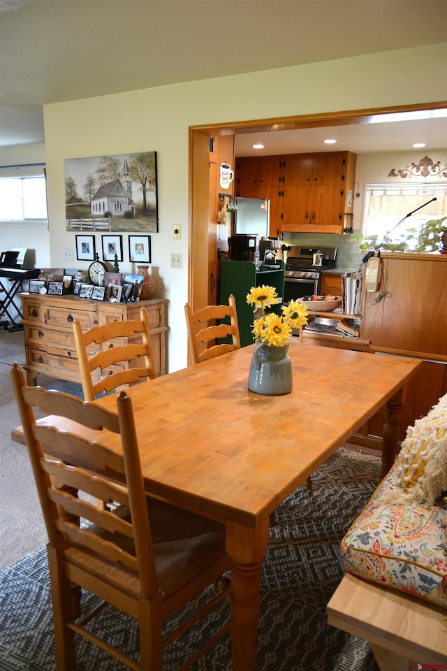 8801 2100th Rd, Austin, CO 81410 - carpeted dining space featuring plenty of natural light and recessed lighting