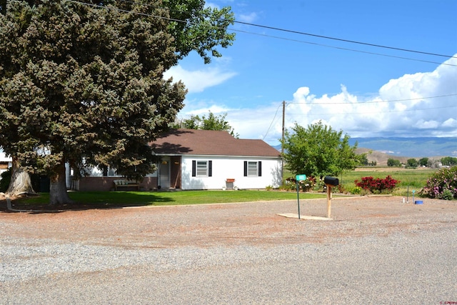 8801 2100th Rd, Austin, CO 81410 - view of front facade with a front lawn