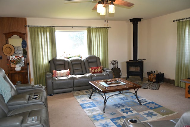 8801 2100th Rd, Austin, CO 81410 - carpeted living room with ceiling fan and a wood stove