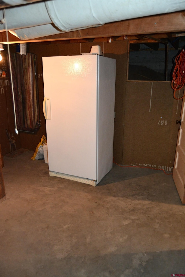 8801 2100th Rd, Austin, CO 81410 - unfinished basement featuring freestanding refrigerator