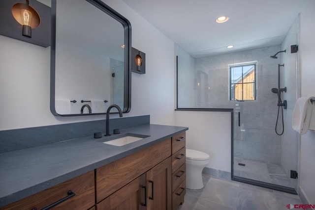 918 Belleview Ave, Crested Butte, CO 81224 - bathroom featuring a stall shower, vanity, toilet, tile patterned flooring, and recessed lighting