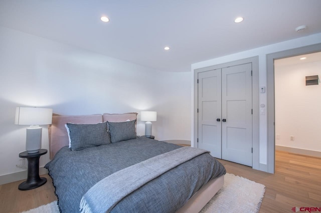 918 Belleview Ave, Crested Butte, CO 81224 - bedroom featuring light wood-style floors, recessed lighting, a closet, and baseboards