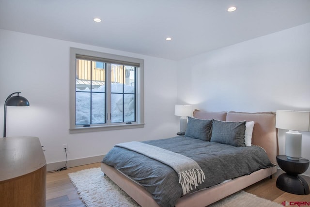 918 Belleview Ave, Crested Butte, CO 81224 - bedroom featuring light wood-style floors, recessed lighting, and baseboards