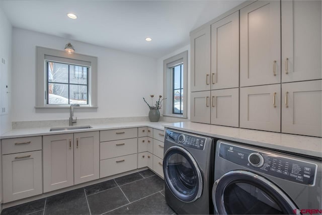 918 Belleview Ave, Crested Butte, CO 81224 - laundry area with washing machine and clothes dryer, cabinet space, healthy amount of natural light, dark tile patterned flooring, and recessed lighting