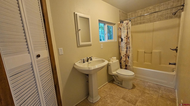 1551 G86 Rd, Delta, CO 81416 - bathroom with toilet, shower / bath combo with shower curtain, tile patterned floors, and a closet