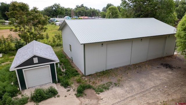 1551 G86 Rd, Delta, CO 81416 - detached garage featuring view of wooded area