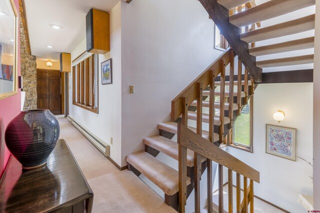 42246 US Highway 50, Gunnison, CO 81230 - staircase featuring a baseboard radiator, baseboards, carpet floors, and recessed lighting