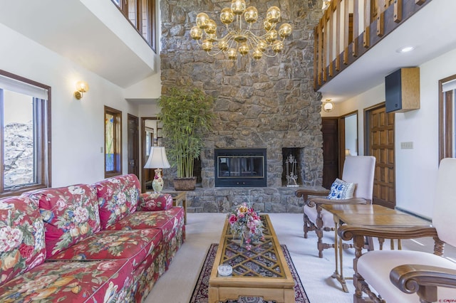 42246 US Highway 50, Gunnison, CO 81230 - living room with a high ceiling, a chandelier, a fireplace, and carpet floors