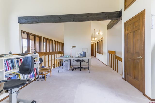 42246 US Highway 50, Gunnison, CO 81230 - carpeted home office with beam ceiling and a chandelier