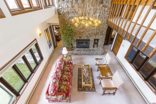 42246 US Highway 50, Gunnison, CO 81230 - living room featuring a high ceiling, a fireplace, and a chandelier