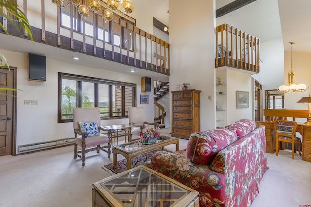 42246 US Highway 50, Gunnison, CO 81230 - living area featuring a chandelier, a high ceiling, carpet floors, baseboard heating, and stairs