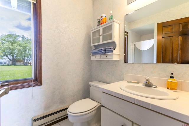 42246 US Highway 50, Gunnison, CO 81230 - full bath featuring a baseboard heating unit, vanity, and toilet