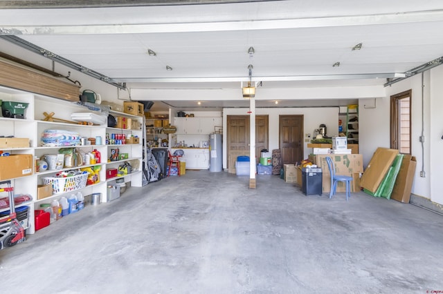 42246 US Highway 50, Gunnison, CO 81230 - garage with electric water heater and a garage door opener