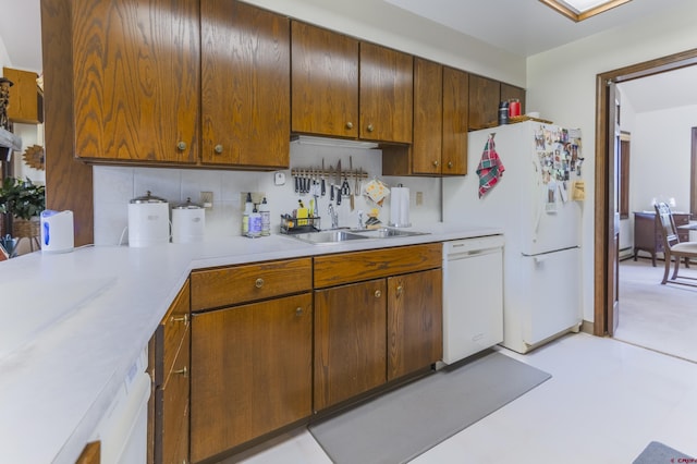 42246 US Highway 50, Gunnison, CO 81230 - kitchen with white appliances, a sink, light countertops, and decorative backsplash