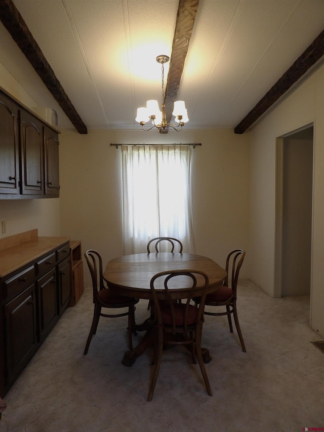 10389 W County Road 7 N, Del Norte, CO 81132 - dining area with a chandelier, beamed ceiling, and light carpet