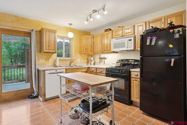 280 Marys Rd, Ridgway, CO 81432 - kitchen with black appliances, light brown cabinets, light countertops, and a sink
