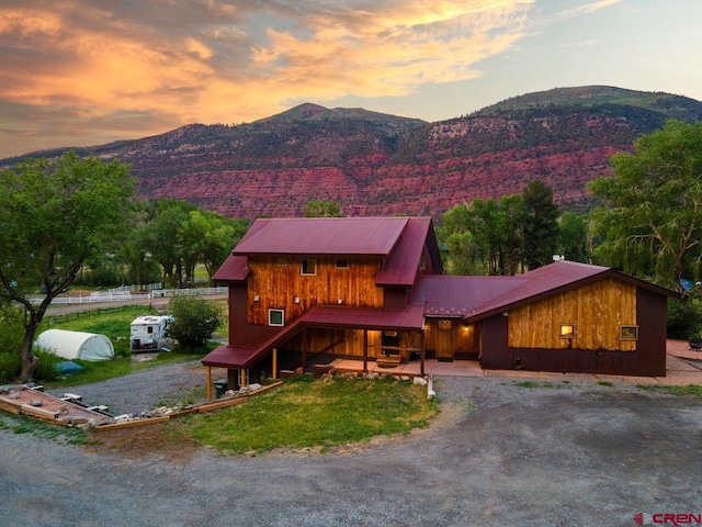 280 Marys Rd, Ridgway, CO 81432 - view of front of home featuring driveway, metal roof, and a mountain view