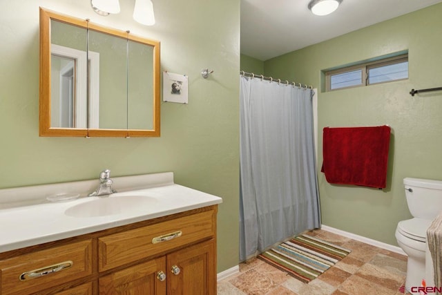 280 Marys Rd, Ridgway, CO 81432 - full bathroom featuring toilet, vanity, a shower with curtain, and baseboards