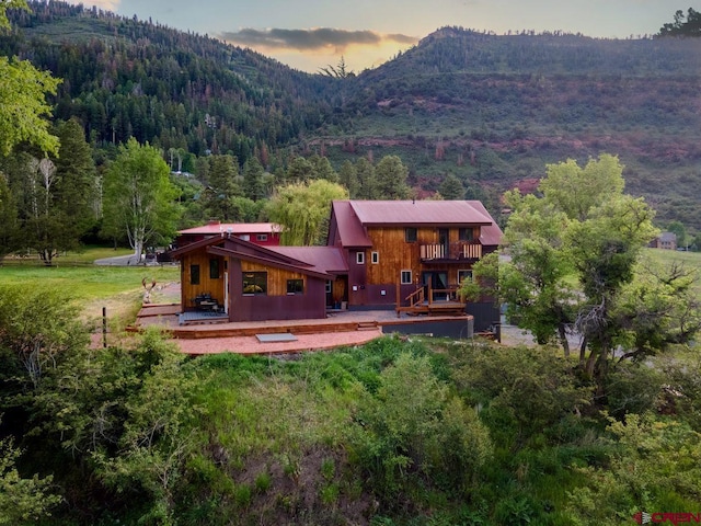 280 Marys Rd, Ridgway, CO 81432 - back of property featuring a wooded view and a deck with mountain view