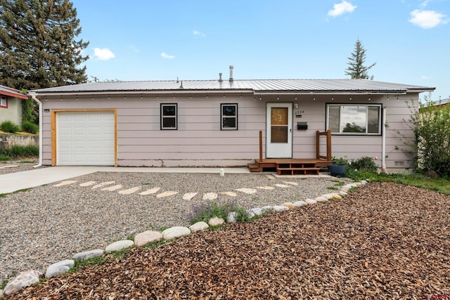2224 Crestview Dr, Durango, CO 81301 - ranch-style house with an attached garage, metal roof, and concrete driveway