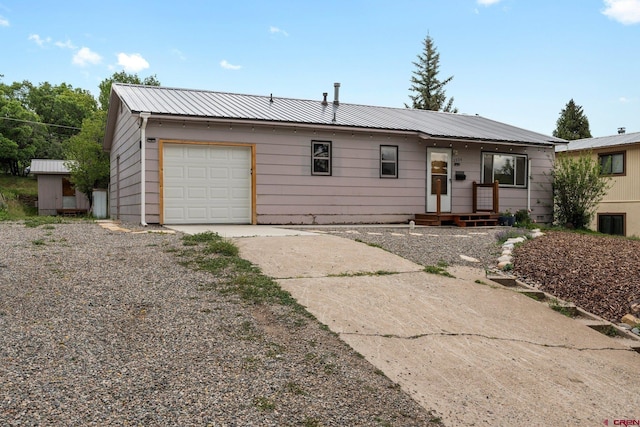 2224 Crestview Dr, Durango, CO 81301 - ranch-style home with driveway, metal roof, and an attached garage