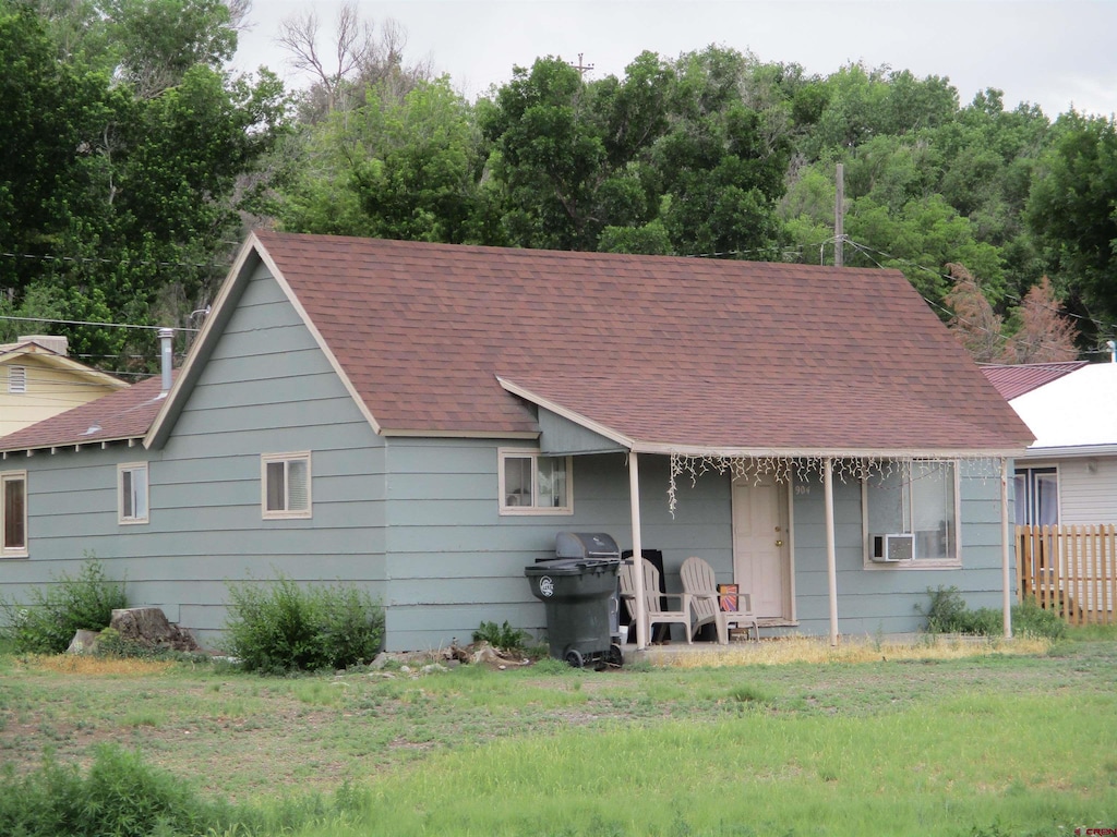 904 Bluff St, Delta, CO 81416 - rear view of property featuring a shingled roof and cooling unit